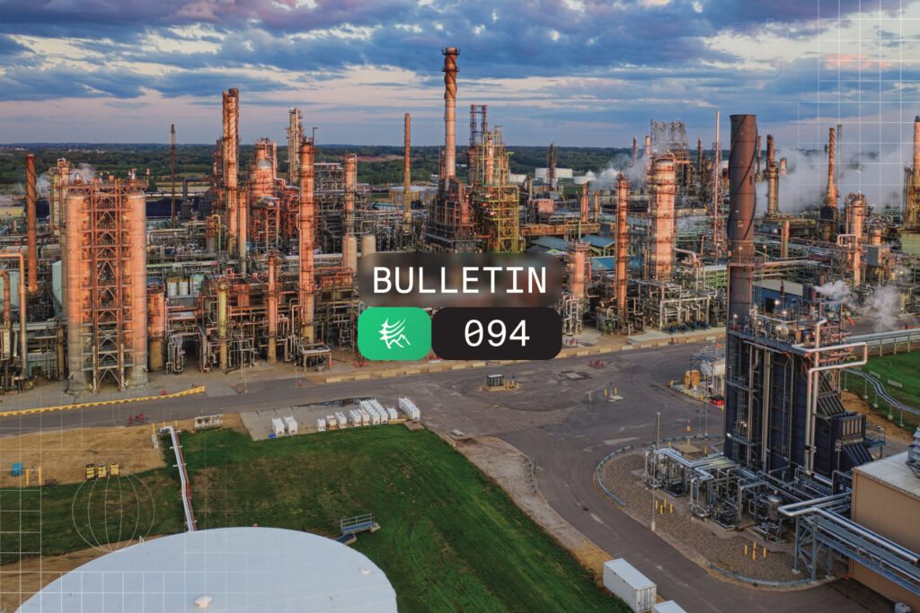 Industrial oil refinery complex with tall distillation columns and piping, overlaid with a dark rounded banner reading 'BULLETIN' and a black badge '094'.